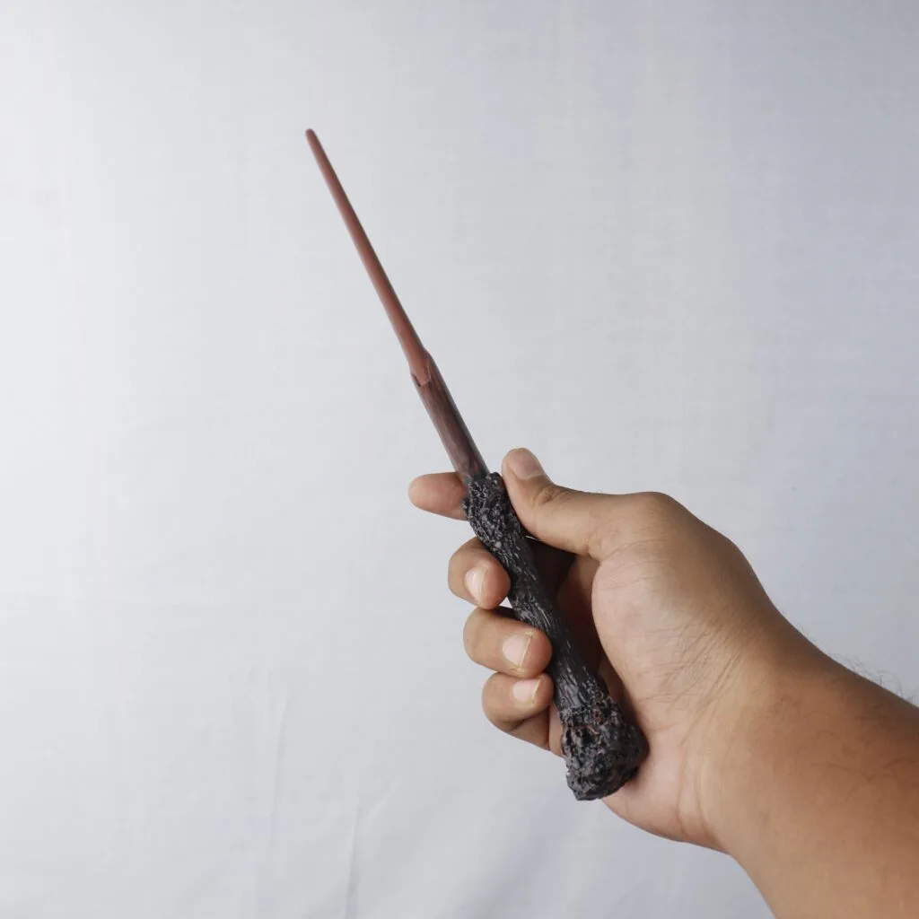 Harry Potter Wand in hand