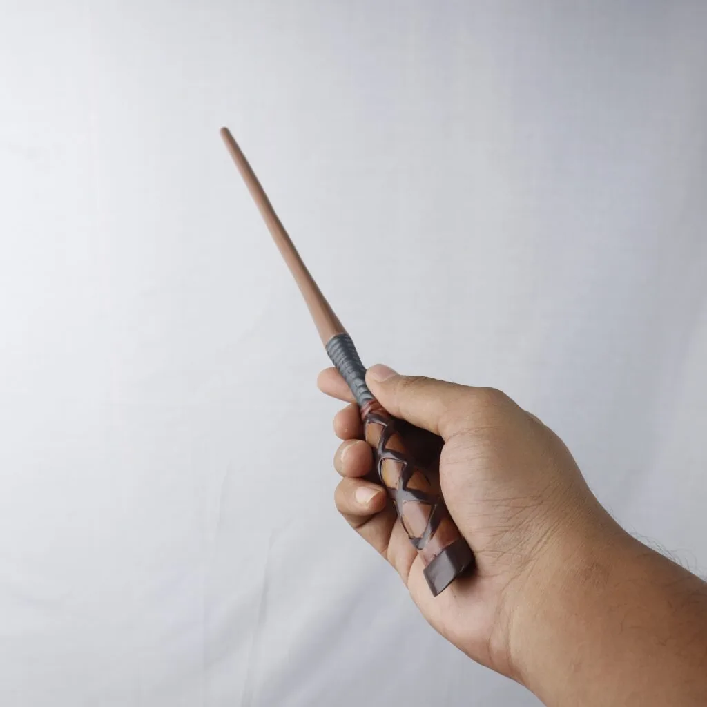 George Weasley Wand in hand